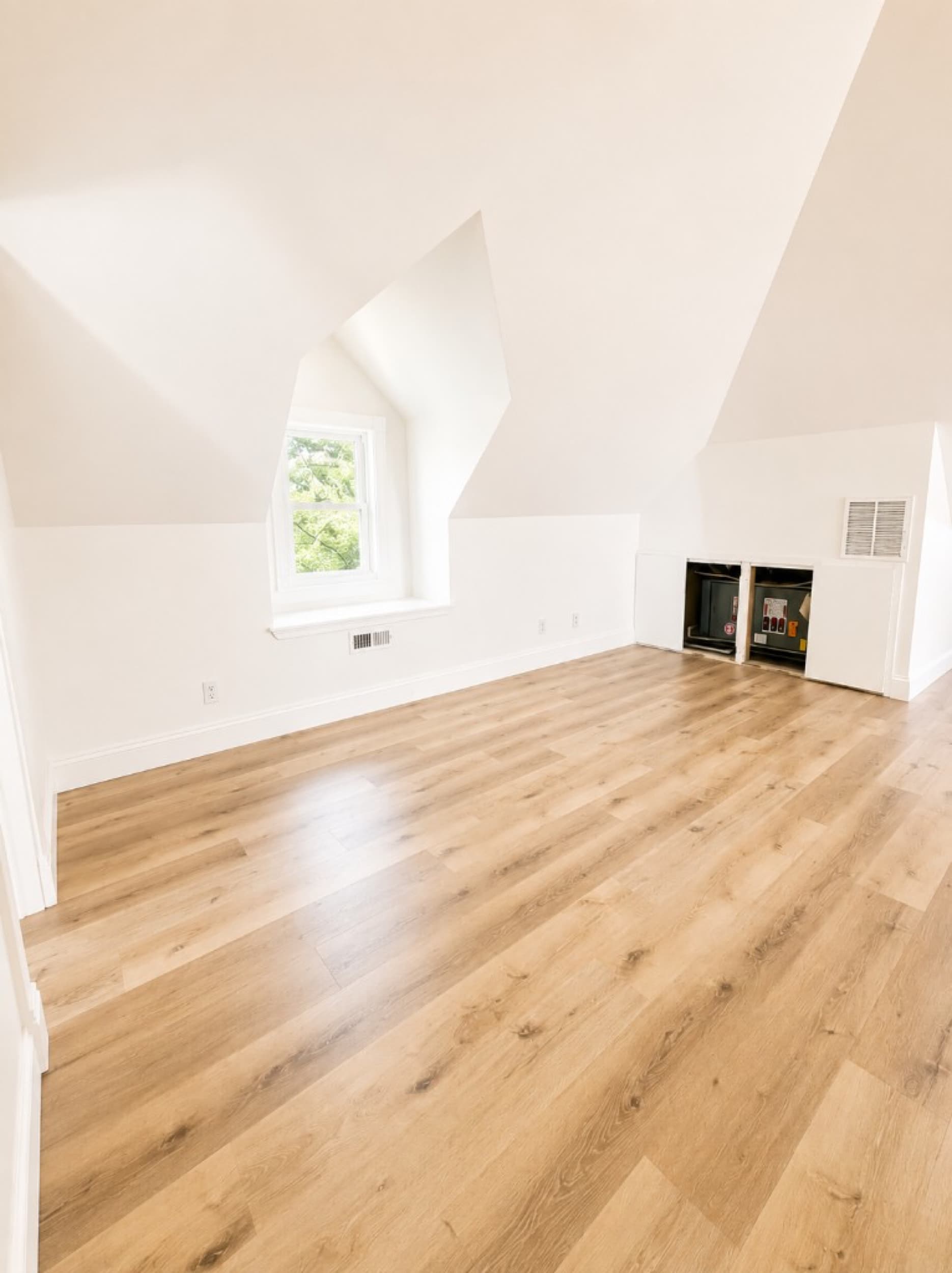 Z Tucker Properties — LVP flooring in finished attic space