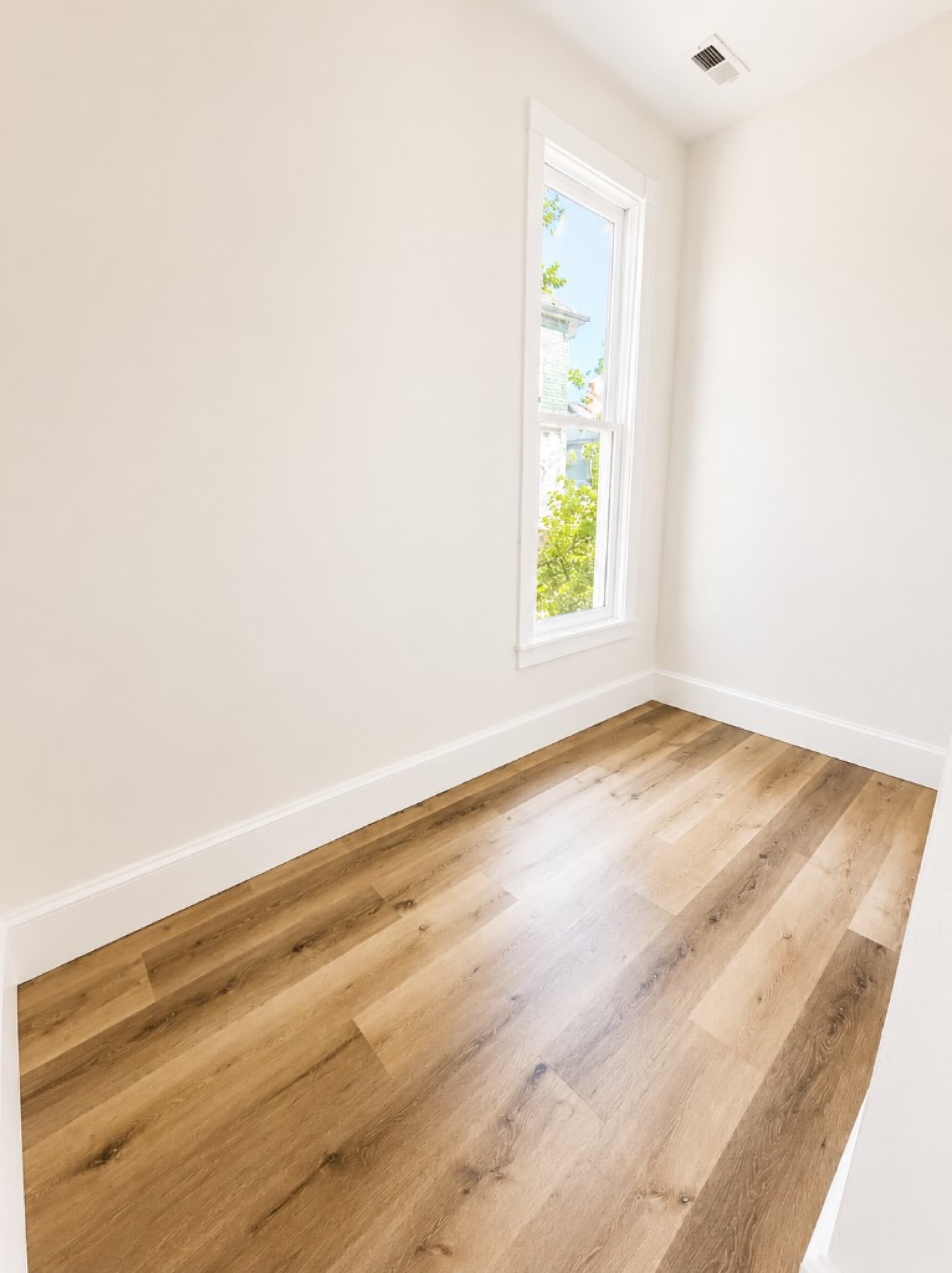 Z Tucker Properties — LVP flooring in bedroom