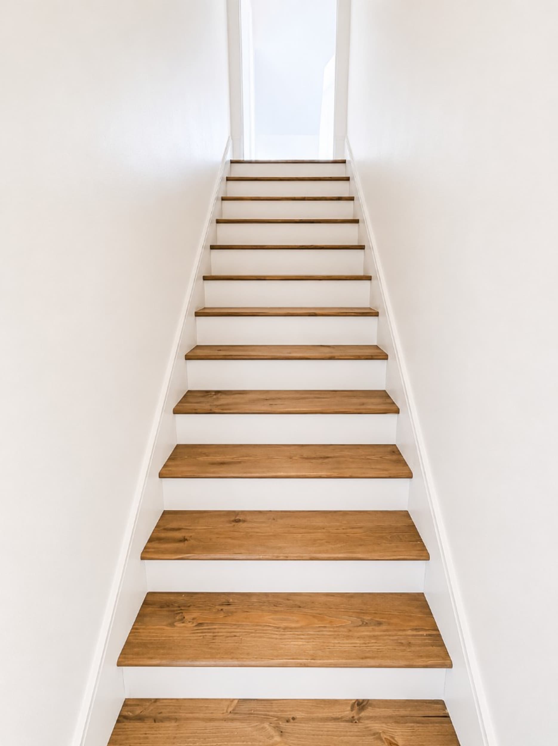 Z Tucker Properties — wood tread staircase with white risers