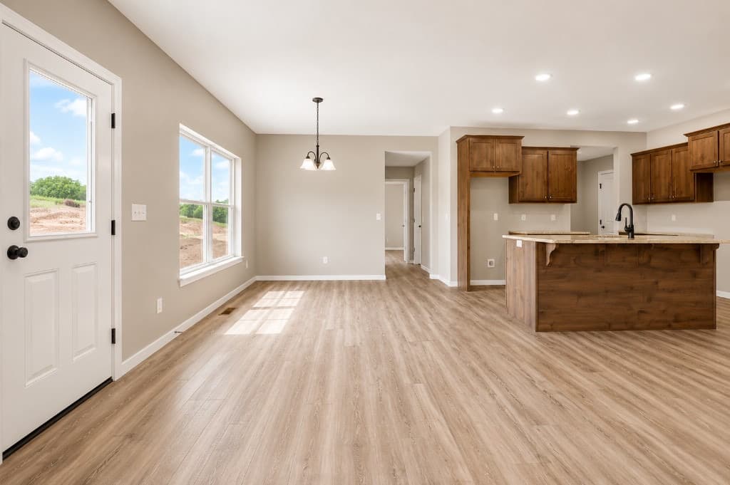 Clear Creek Properties — kitchen island and living area with LVP throughout