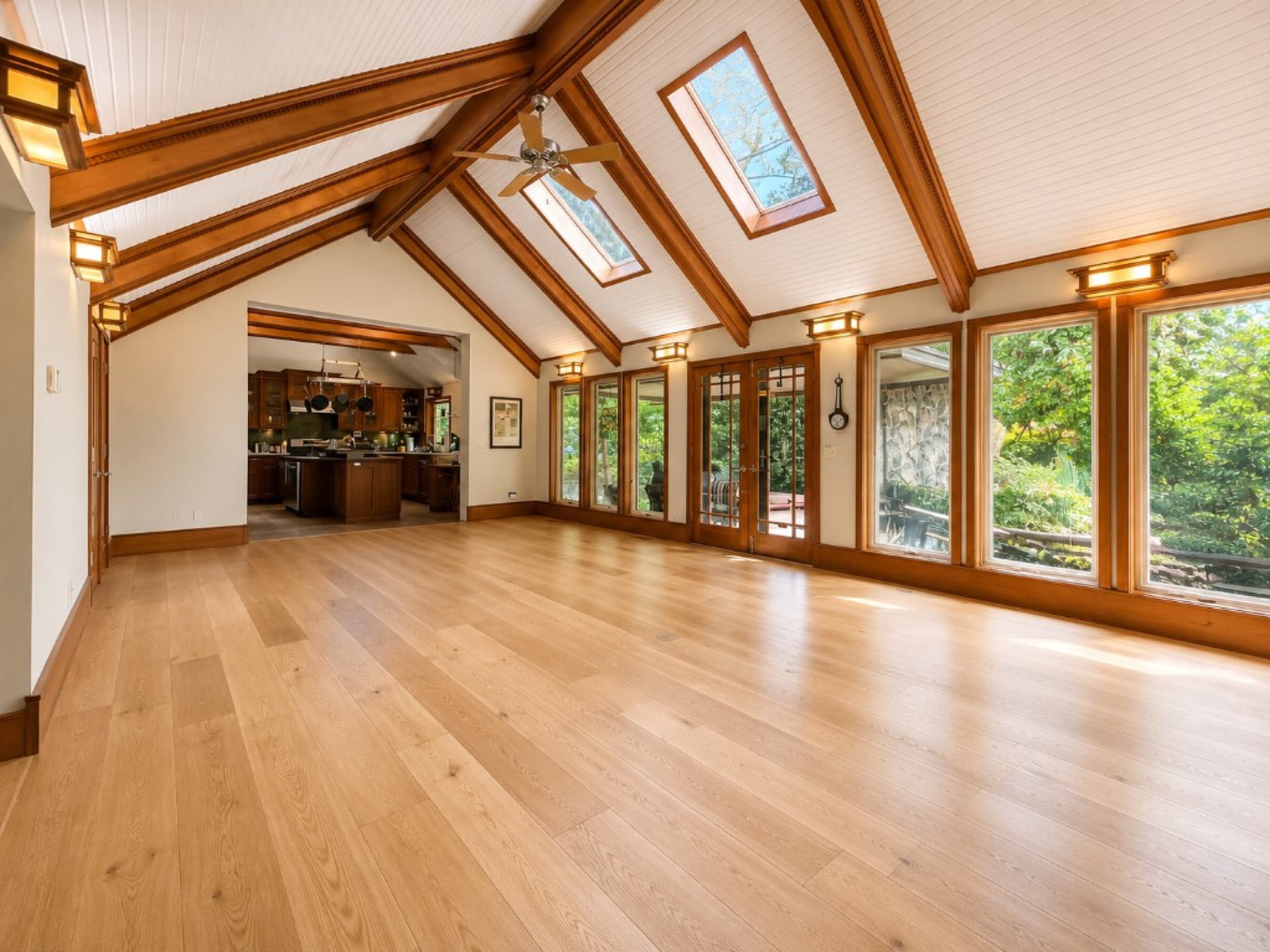 Stoneridge Flooring Designs — wide-plank hardwood in open-concept living space