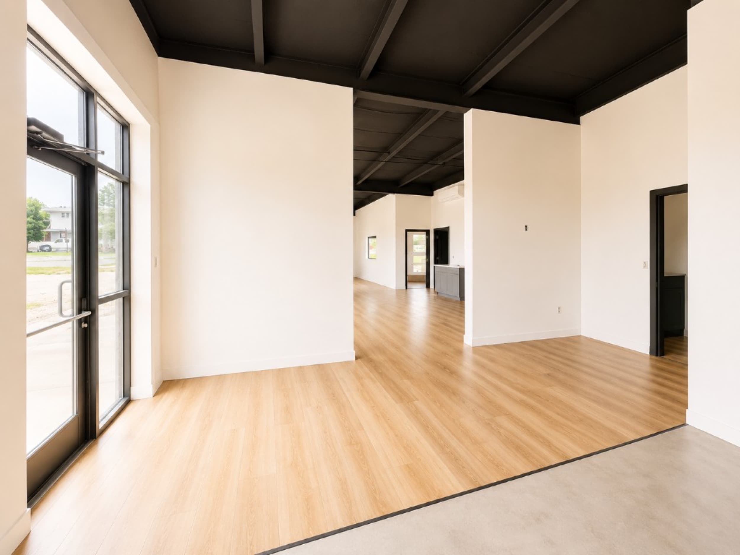 Kinsman Construction — LVP flooring and polished concrete in commercial interior
