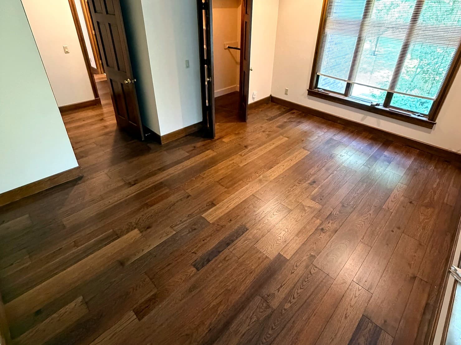 Custom Springfield home — hardwood flooring, interior doors, and matching wood trim